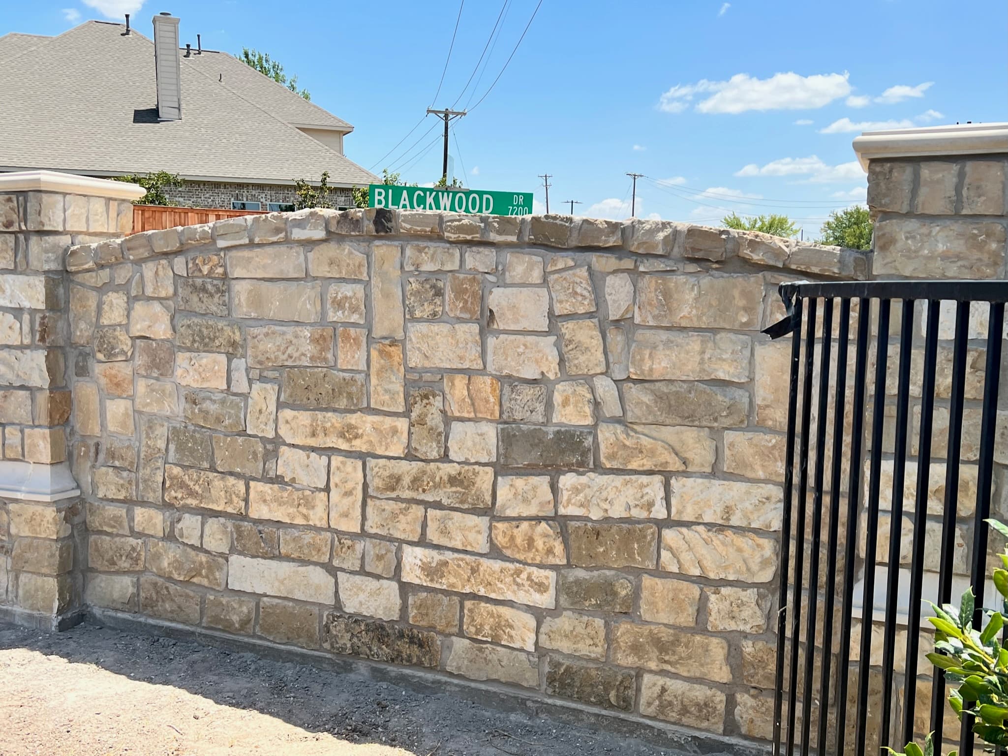 Omega Masonry technician applying fresh mortar during a tuckpointing project in McKinney, TX